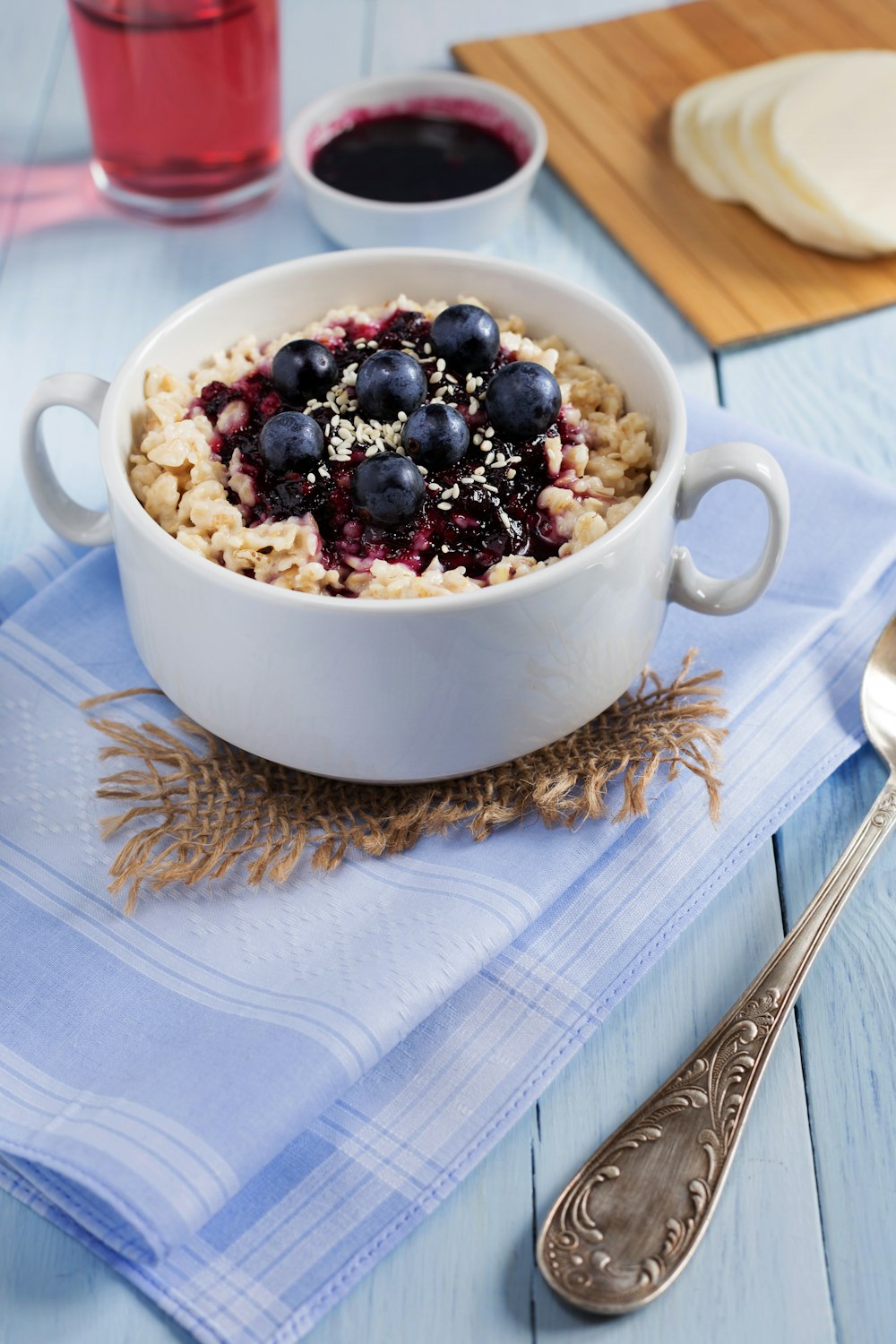 a bowl of oatmeal with blueberries and nuts