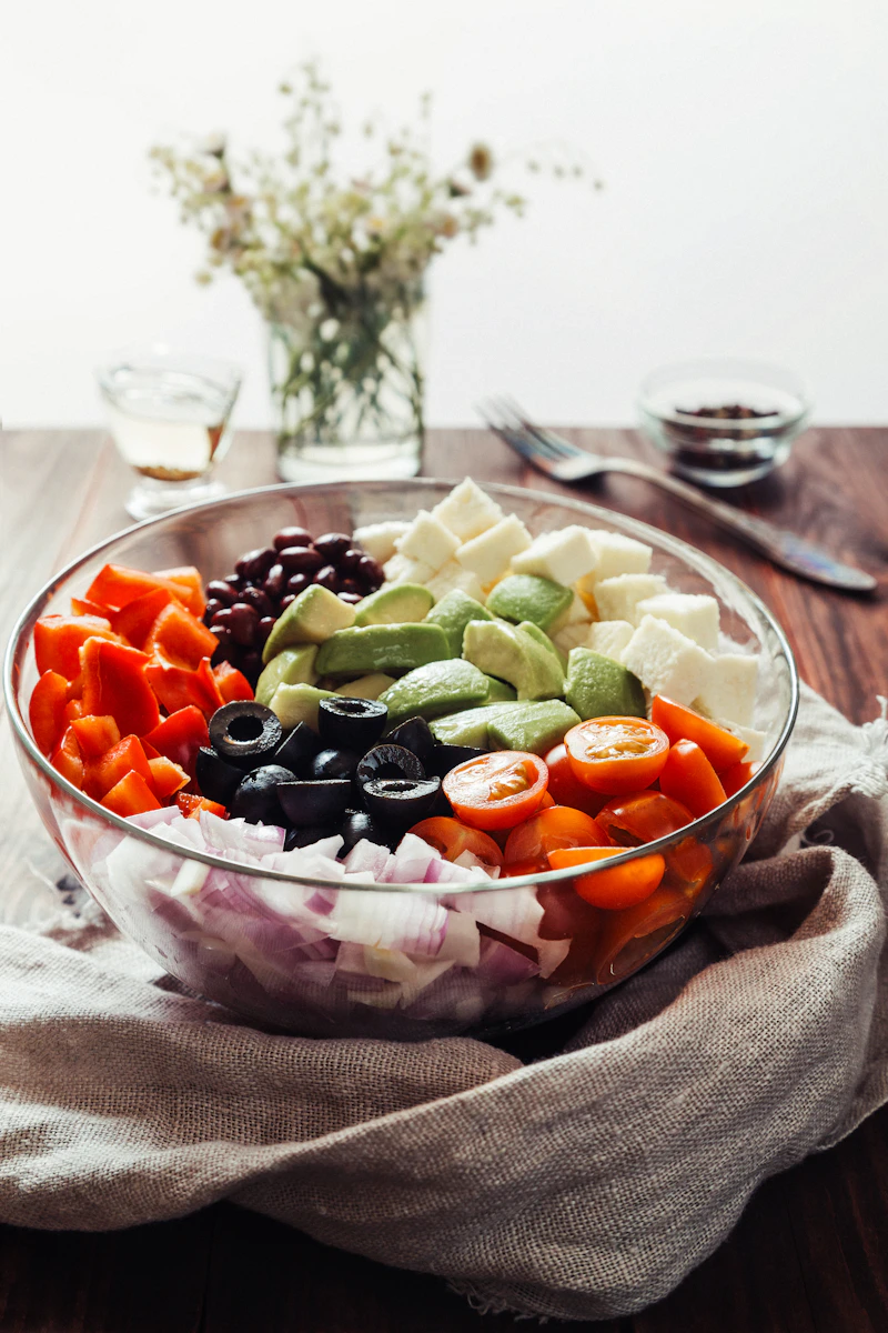Illustrative garden salad with avocado, tomatoes and olives