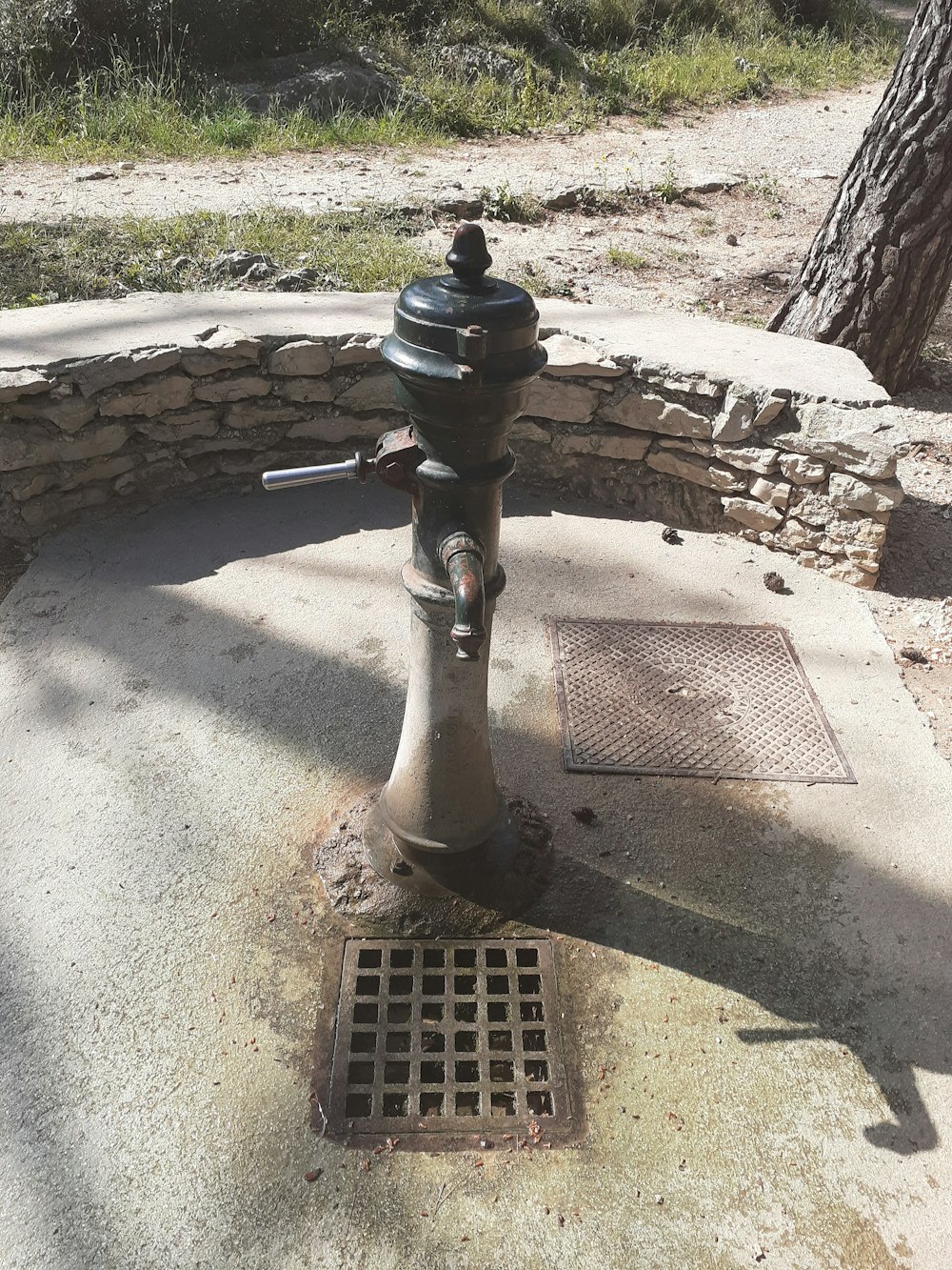 a fire hydrant sitting on the side of a road