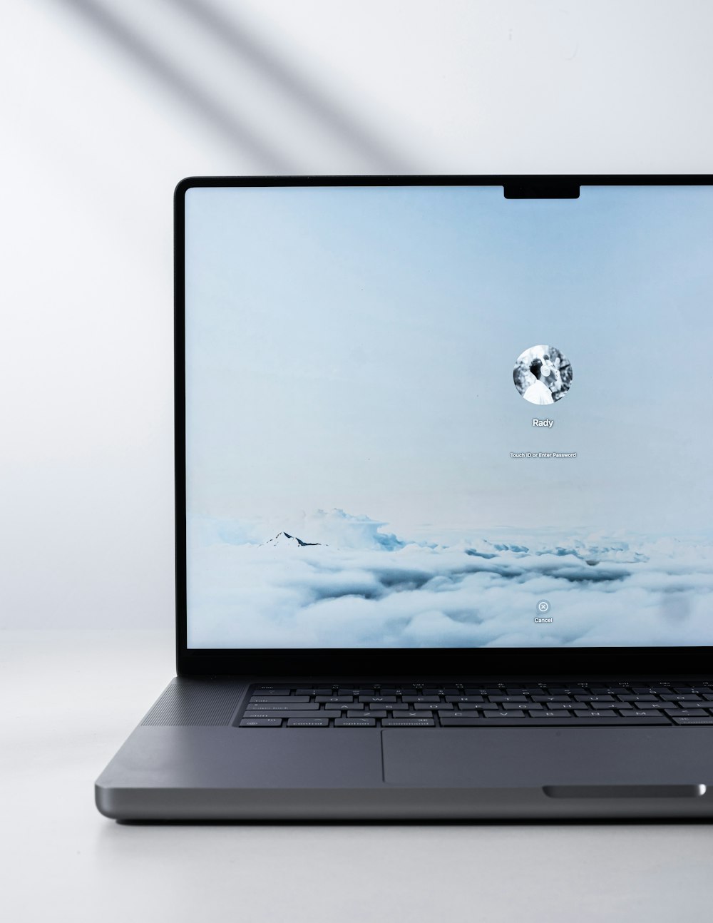 a laptop computer sitting on top of a white table