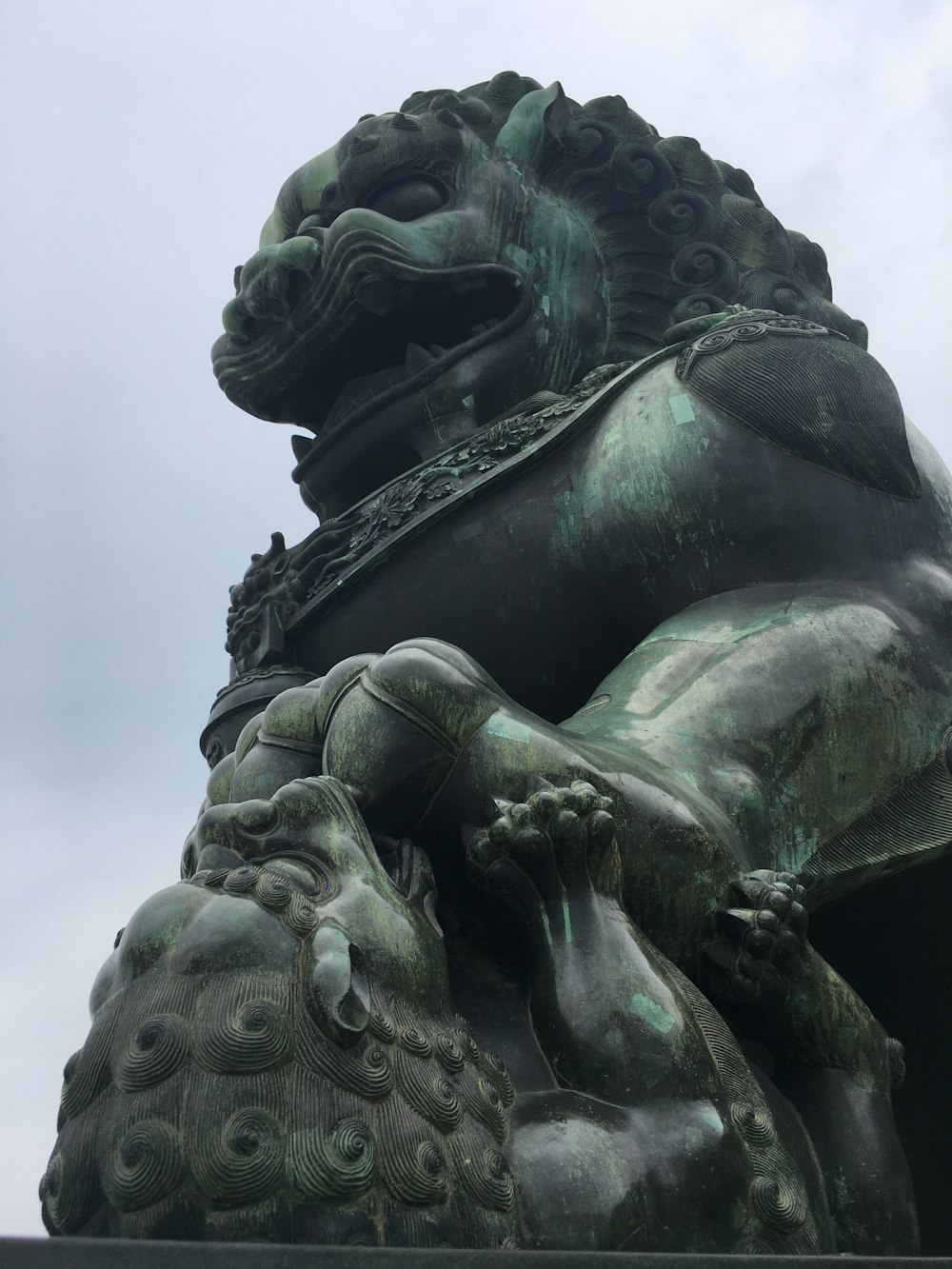 a statue of a lion with a crown on it's head