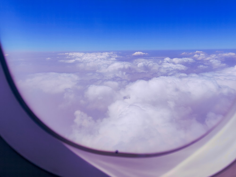 a view of clouds from an airplane window