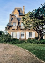 A charming house exterior with a well-kept garden.