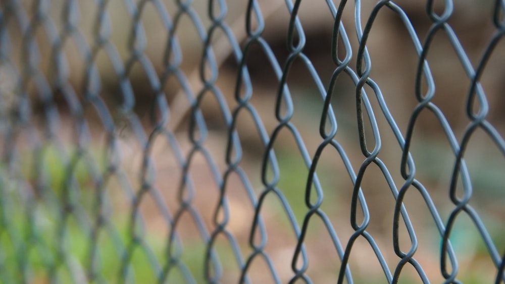 a close up of a chain link fence