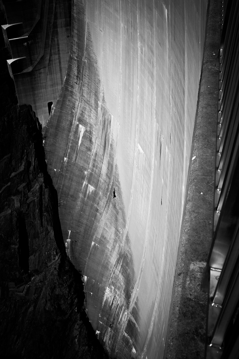 a black and white photo of a waterfall