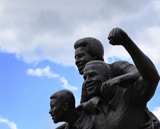 a statue of a man holding a child