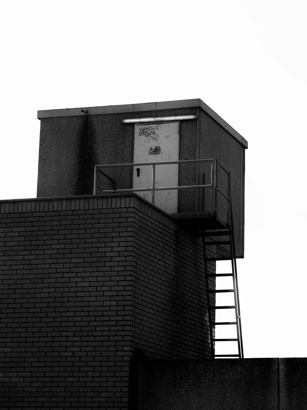 a black and white photo of a clock tower