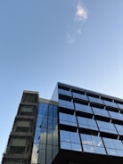 a very tall building next to a very tall building