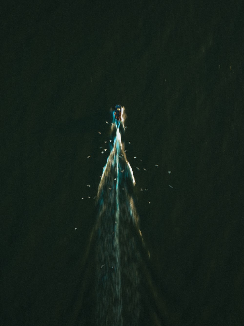 a jet flying through the air at night