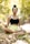 A peaceful outdoor setting with a person meditating under a tree.