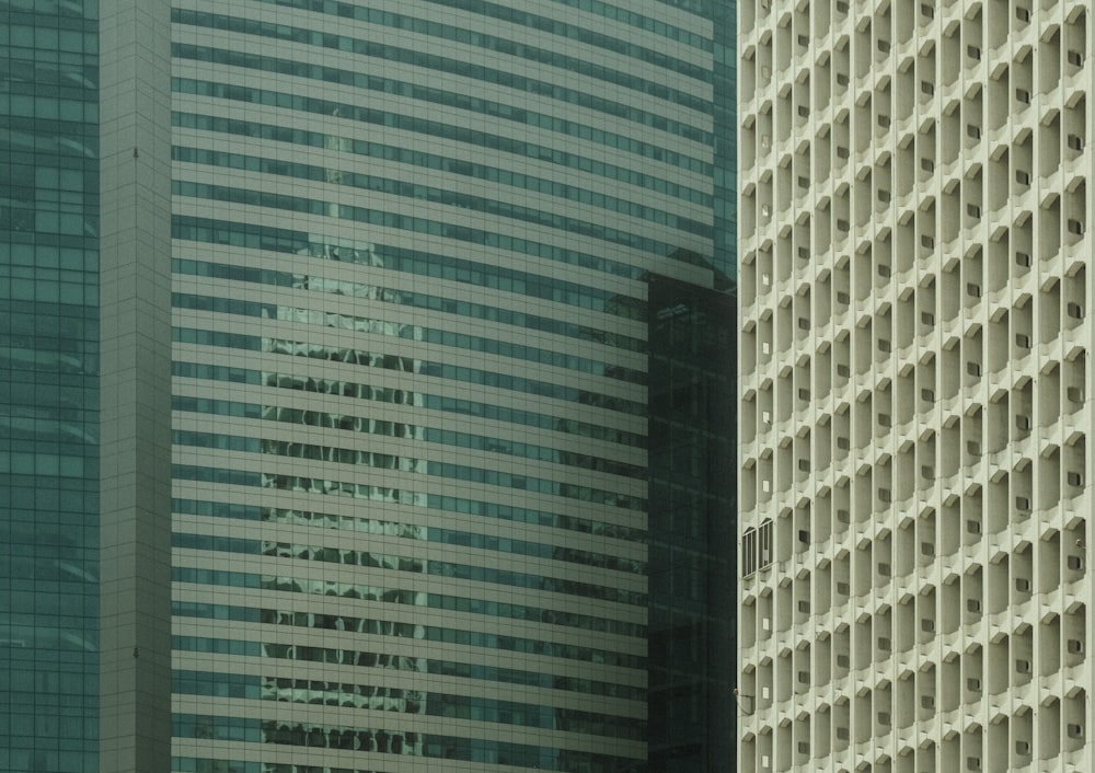 a couple of tall buildings next to each other