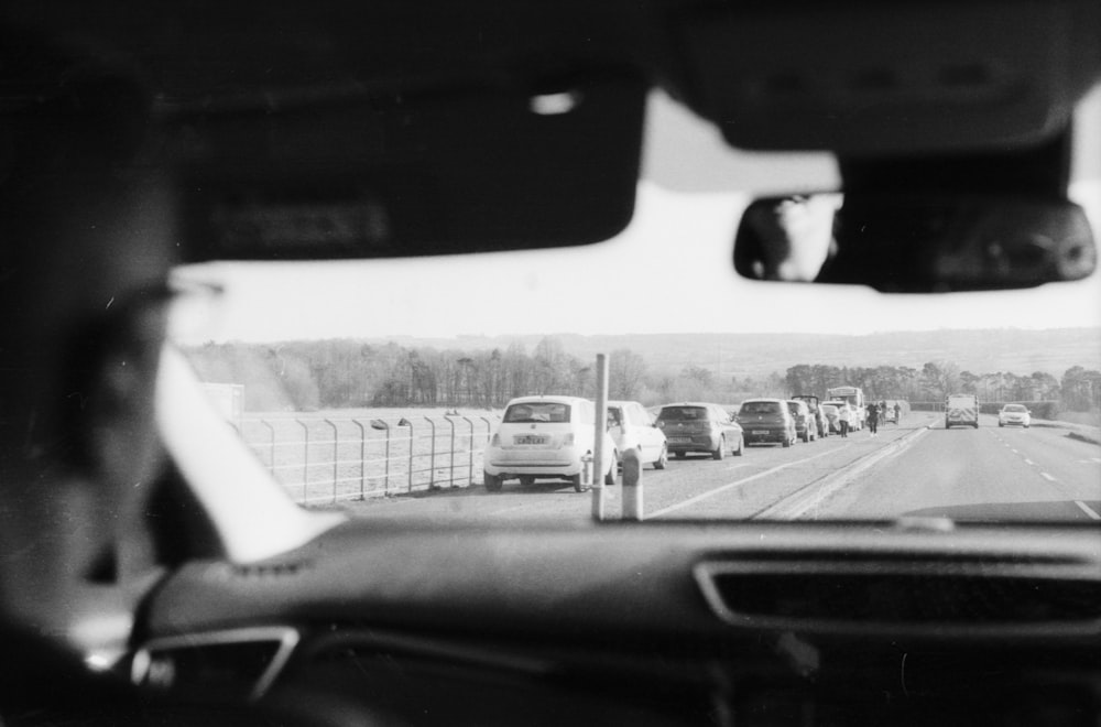 a black and white photo of traffic on a highway