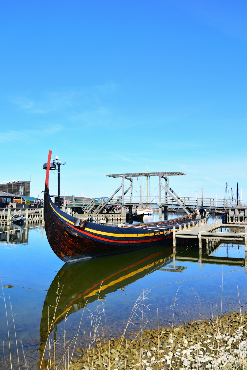 a boat sitting on top of a body of water