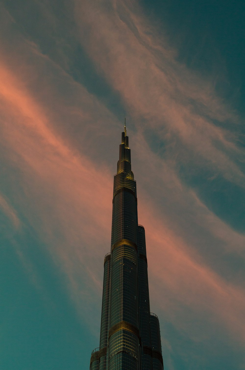 a very tall building with a sky background