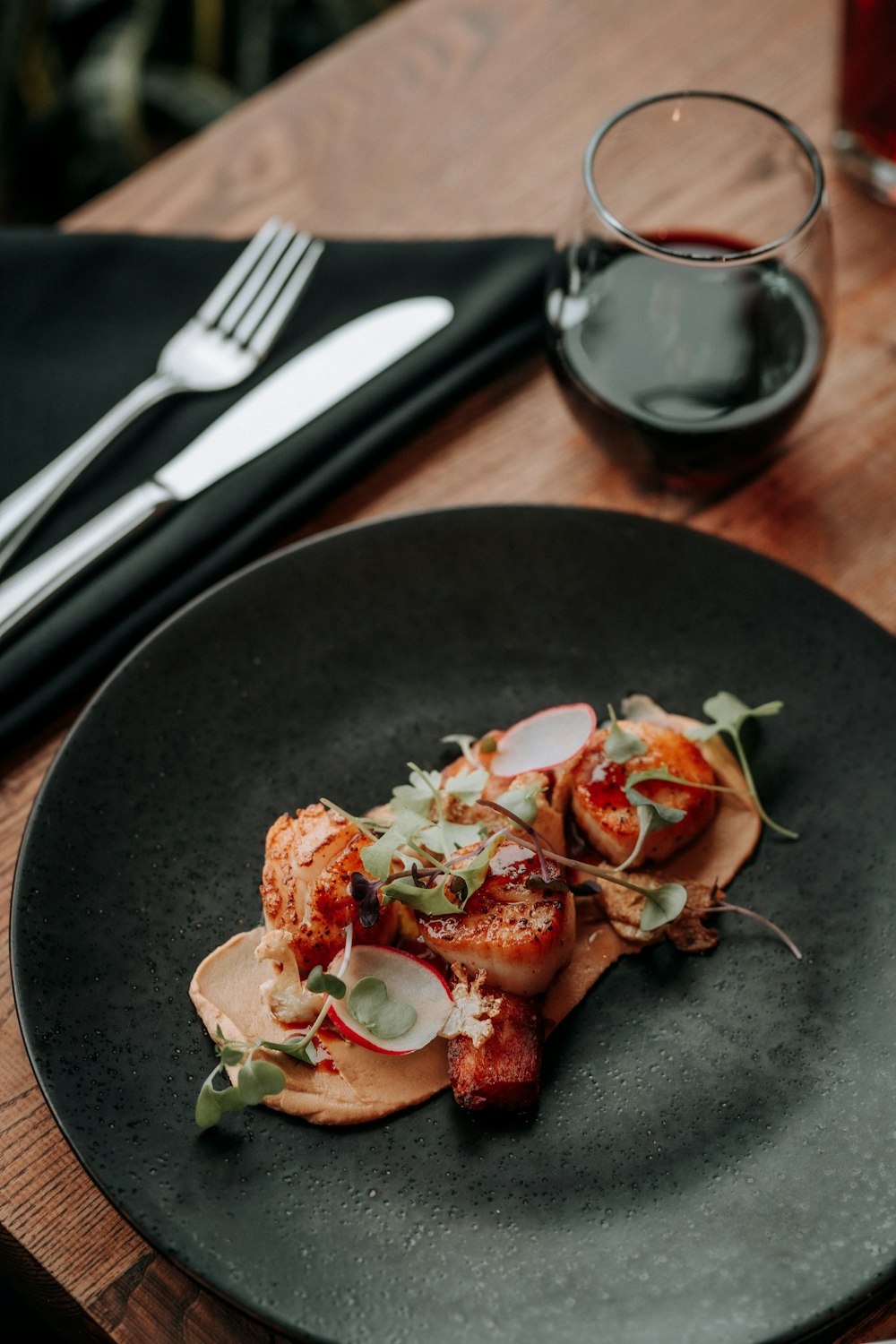 a plate of food on a wooden table