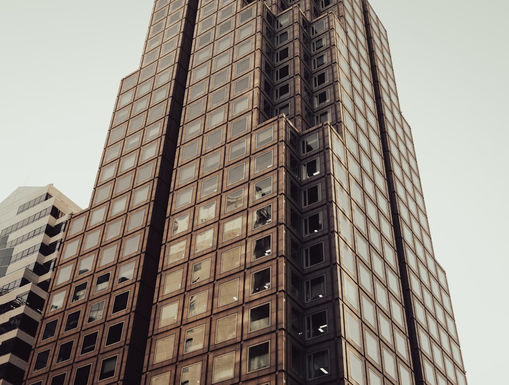 a very tall building with a clock on it's side