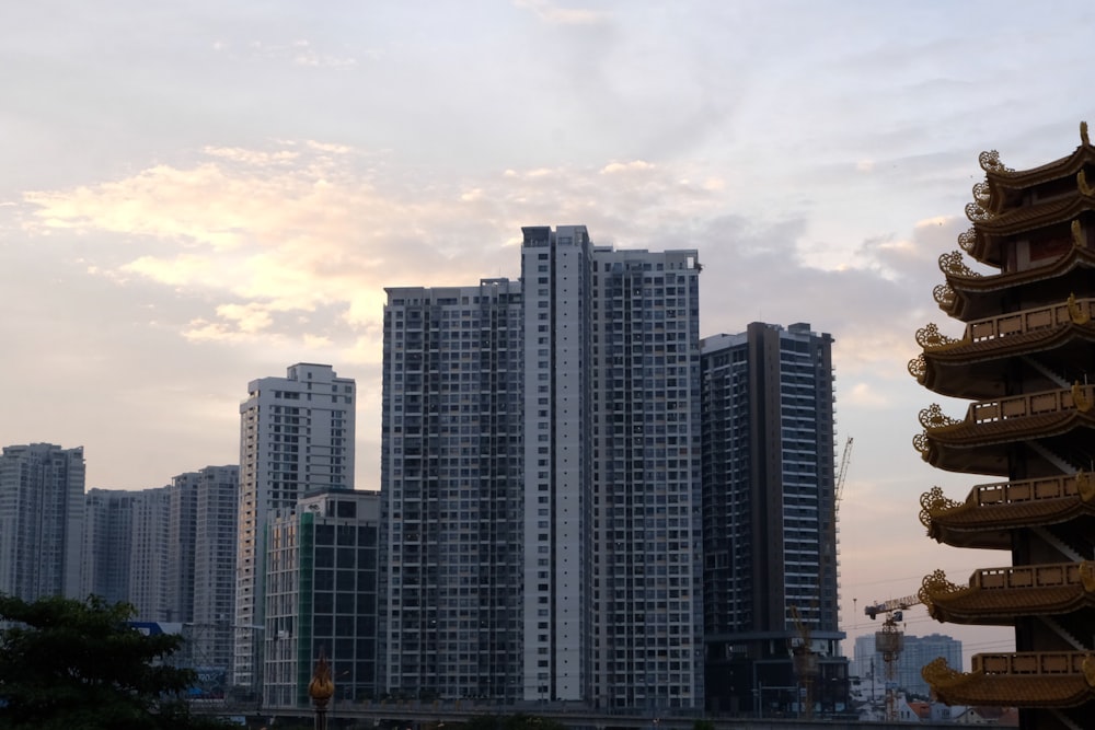 a tall building sitting next to a large city