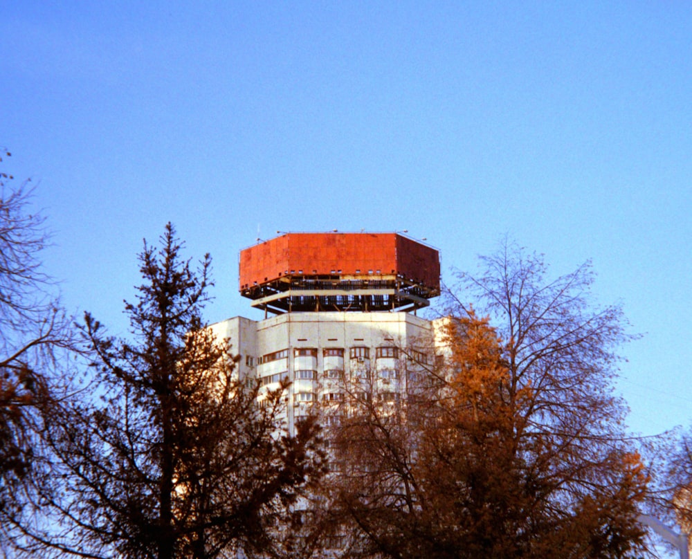 a large white building with a red roof