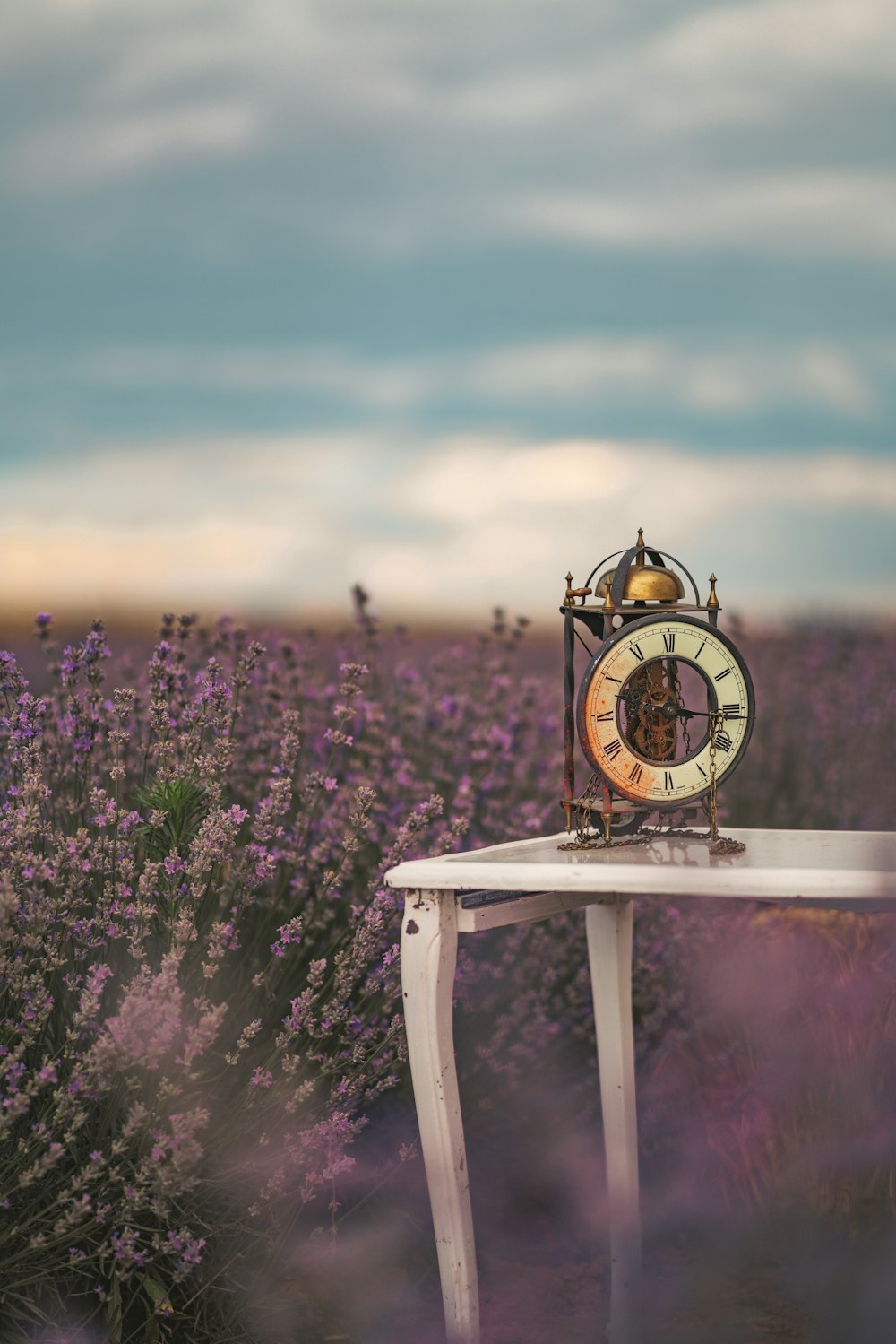 a small table with a clock on top of it