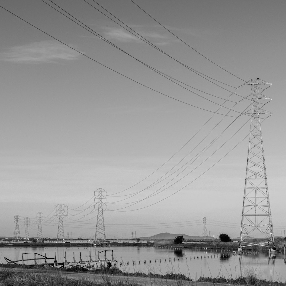 a large body of water with power lines above it