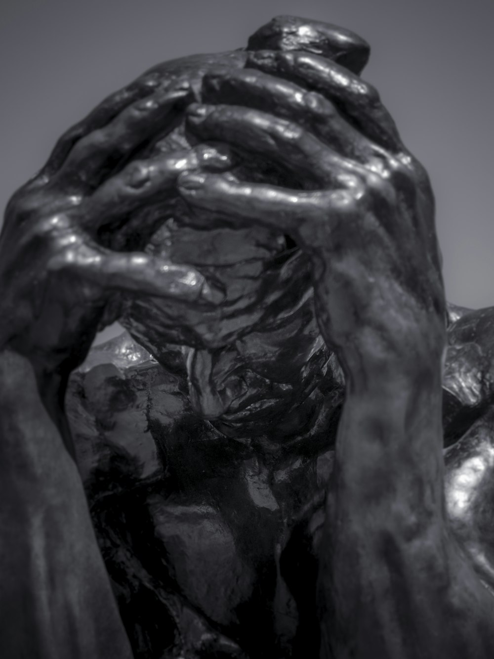 a black and white photo of a statue