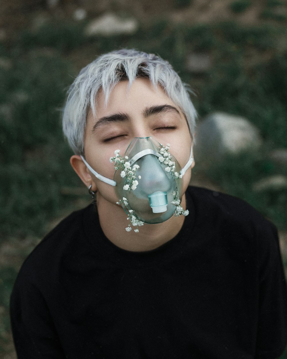 a man with a gas mask on his face