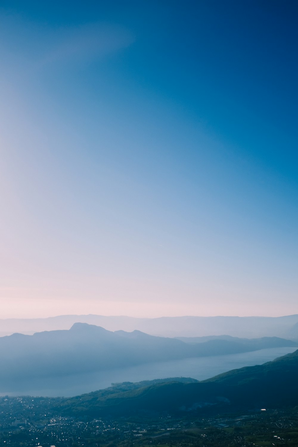 a view of a mountain range with a blue sky