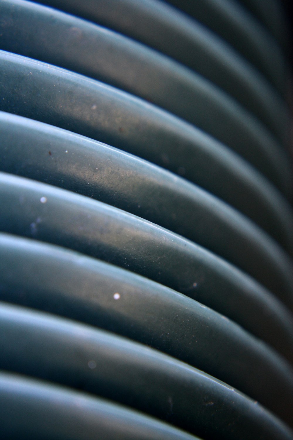 a close up of a stack of blue plates