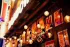 Bright and inviting storefront sign of Luzíntima glowing warmly at dusk.
