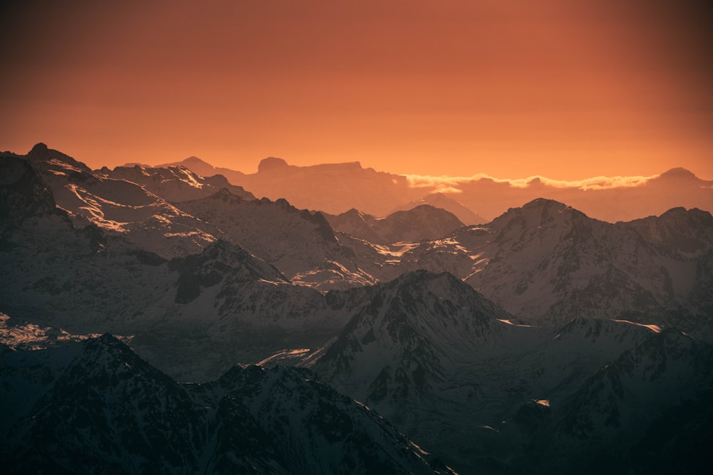 a view of a mountain range at sunset