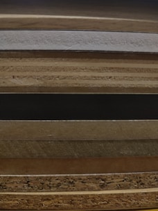 Stack of MDF wooden craft pieces ready for painting and finishing.