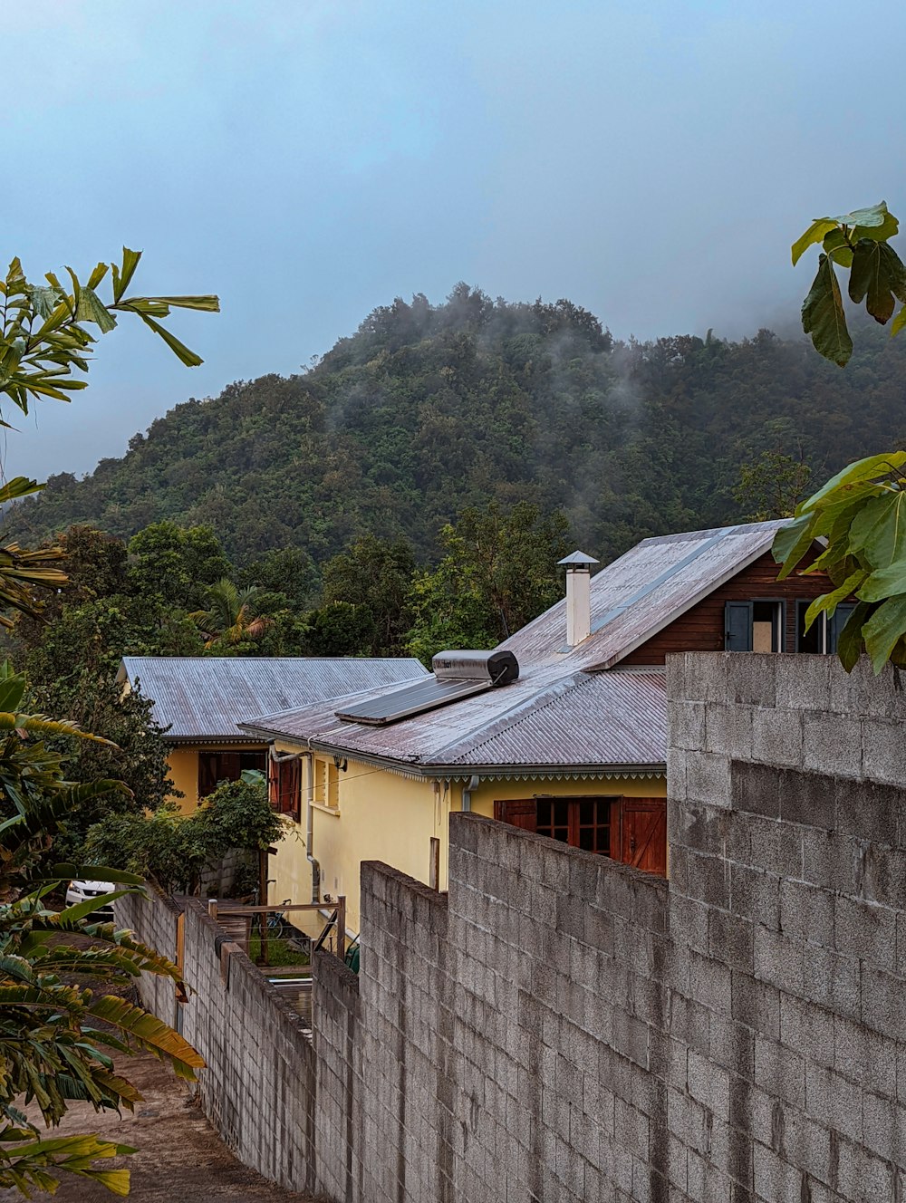 a house with a mountain in the background