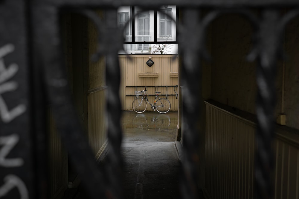 a view of a hallway through a gate