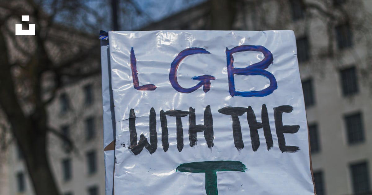 A person holding a sign that says lib with the t photo – Free ...