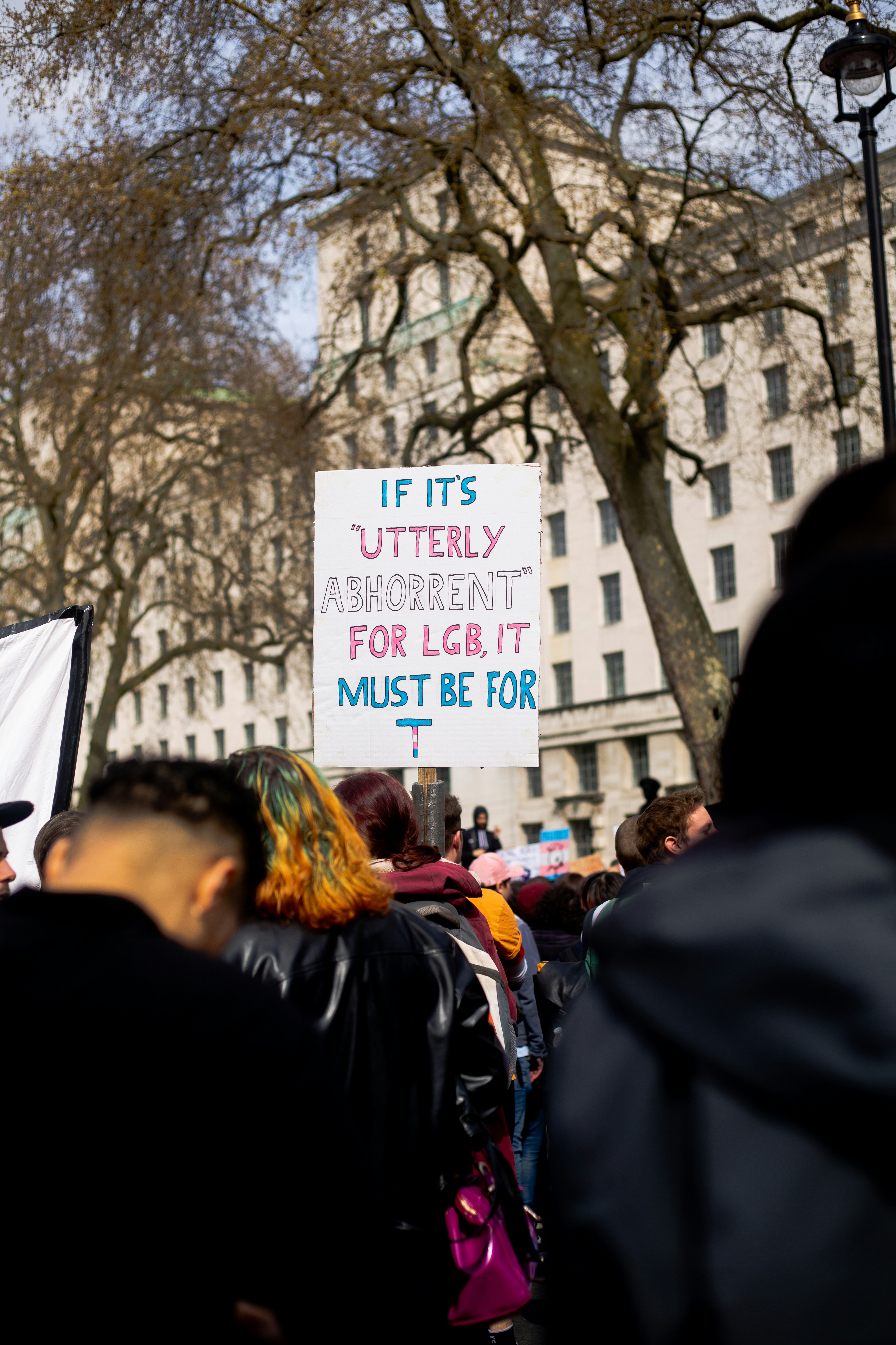 a group of people holding a protest sign