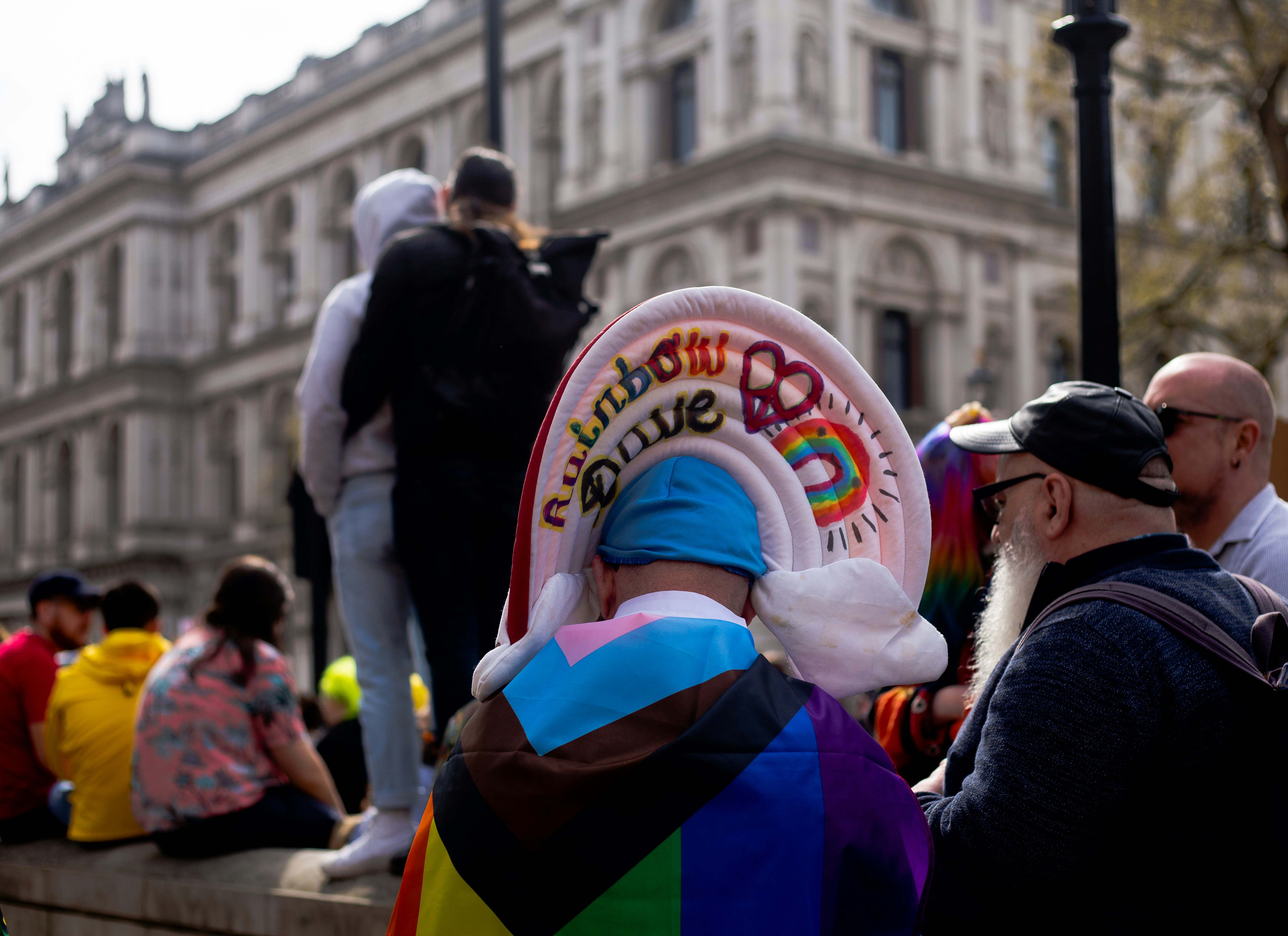 a group of people standing next to each other in front of a building