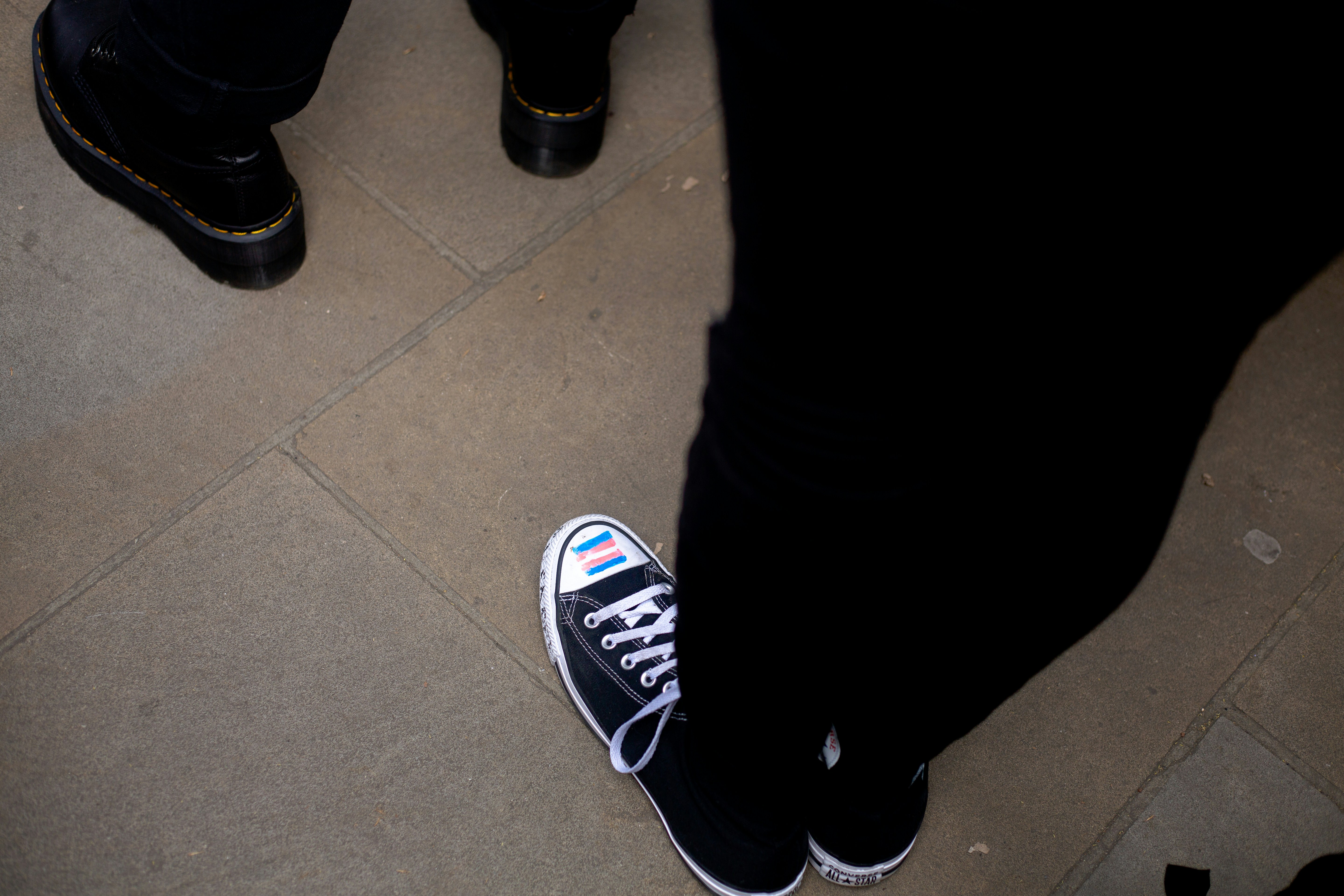 a pair of black and white shoes on the ground