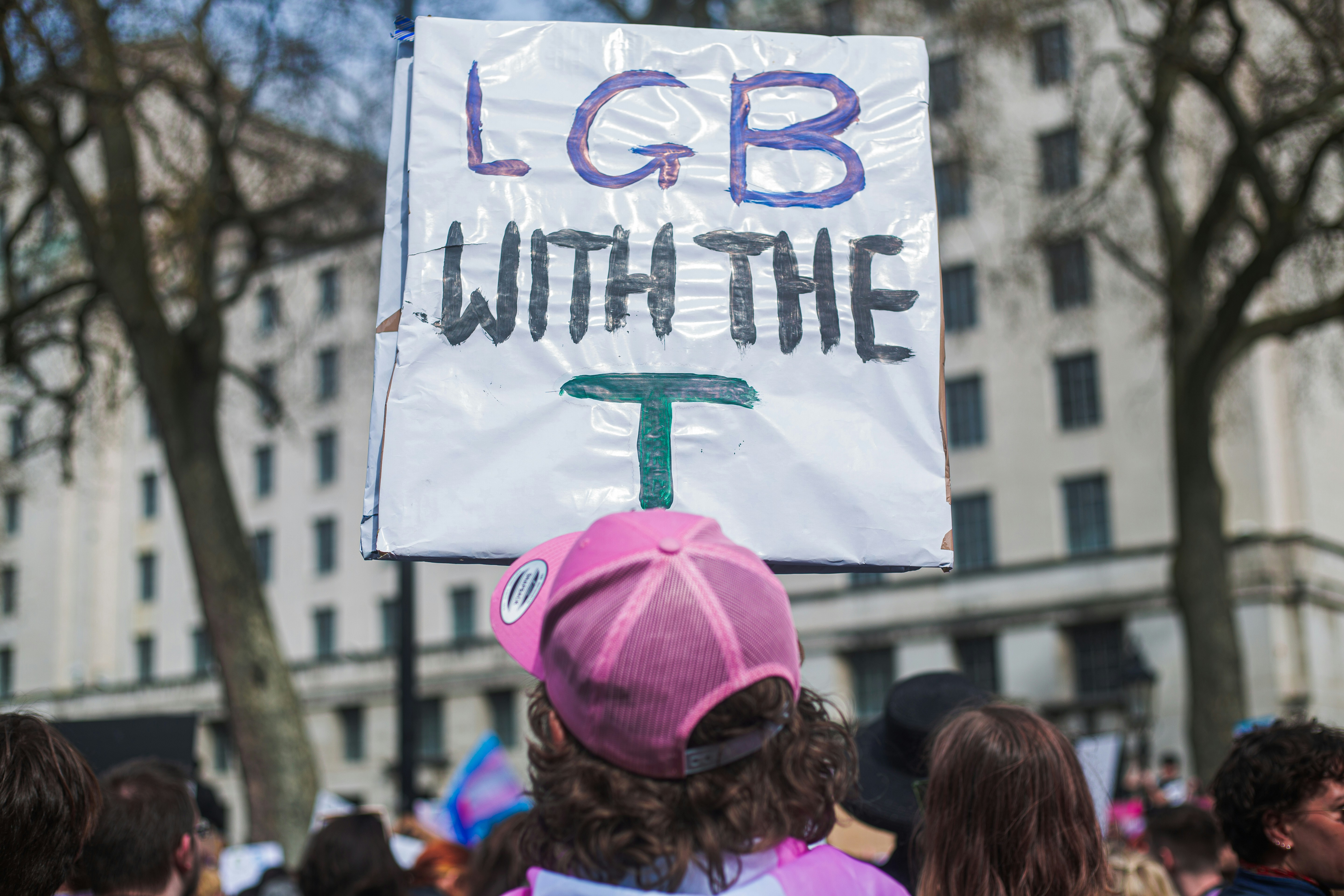 a group of people holding up a sign