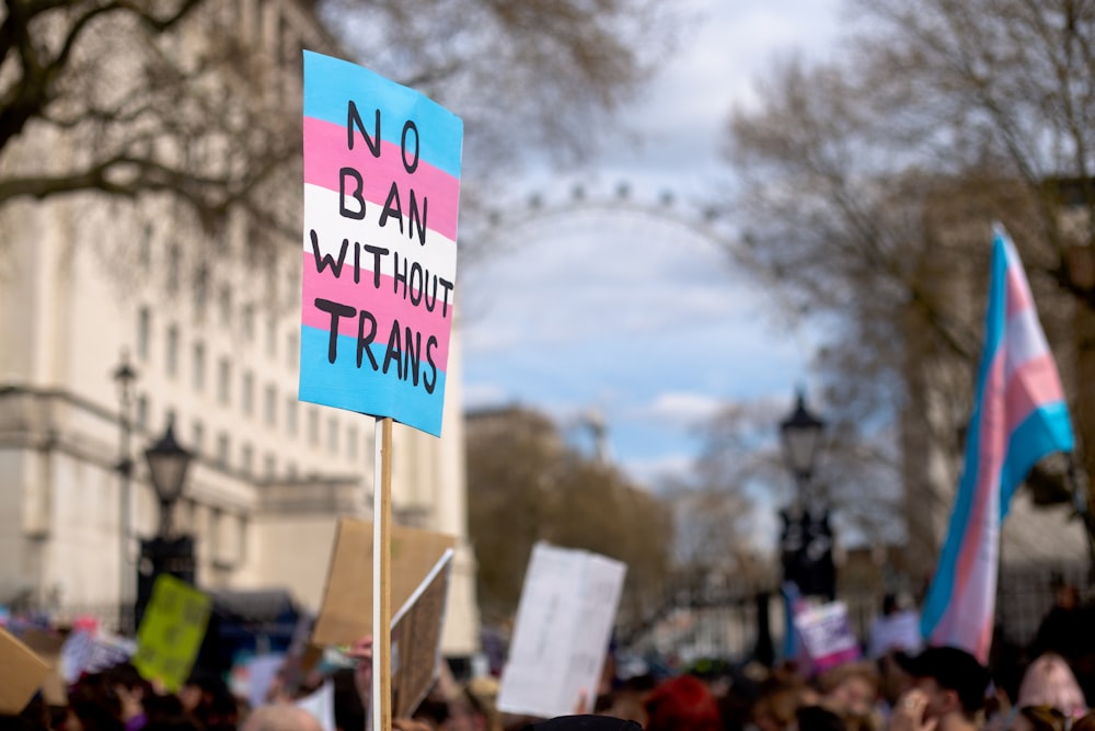 a group of people holding protest signs in front of a building