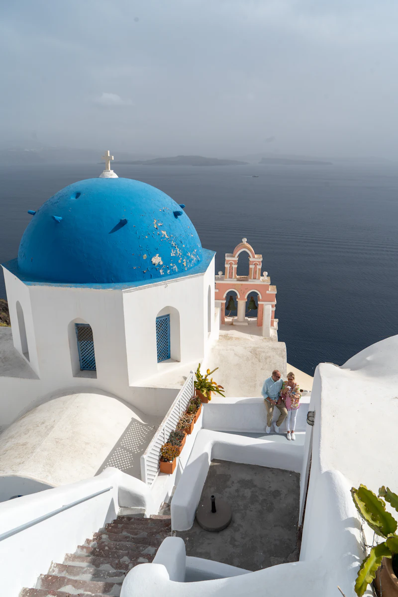 Ultimate Santorini proposal with violinist and drone footage at golden hour