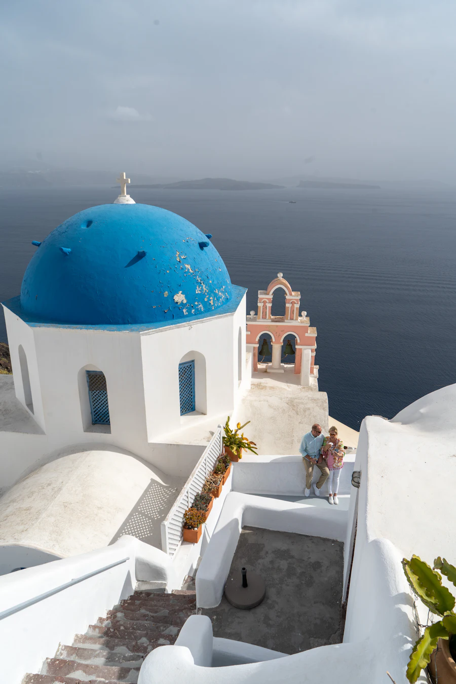 Ultimate Santorini proposal with live musician and drone footage at golden hour on the caldera