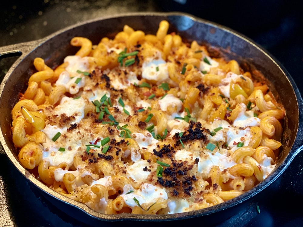 a skillet filled with macaroni and cheese