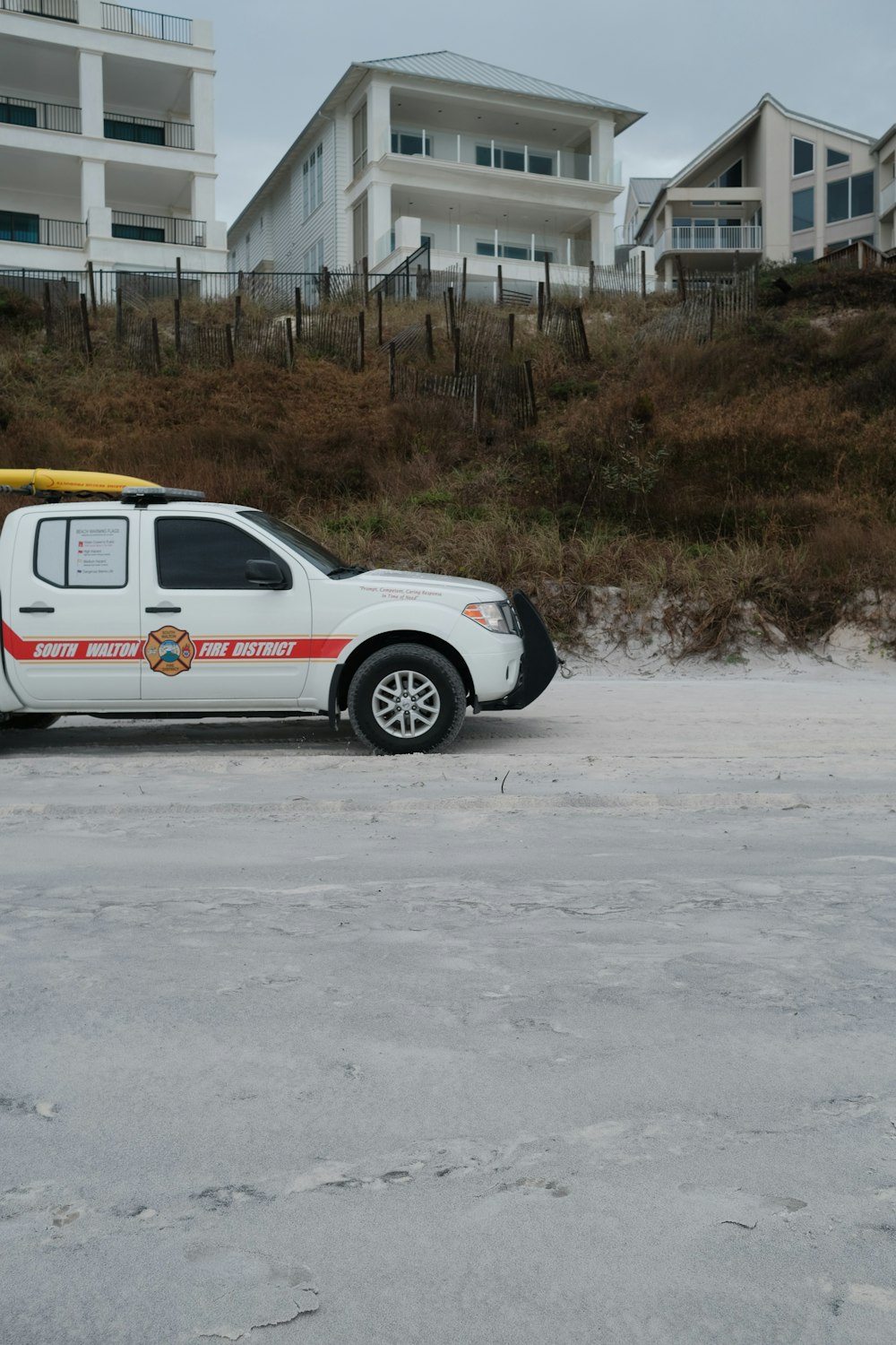 a white police truck parked in a parking lot