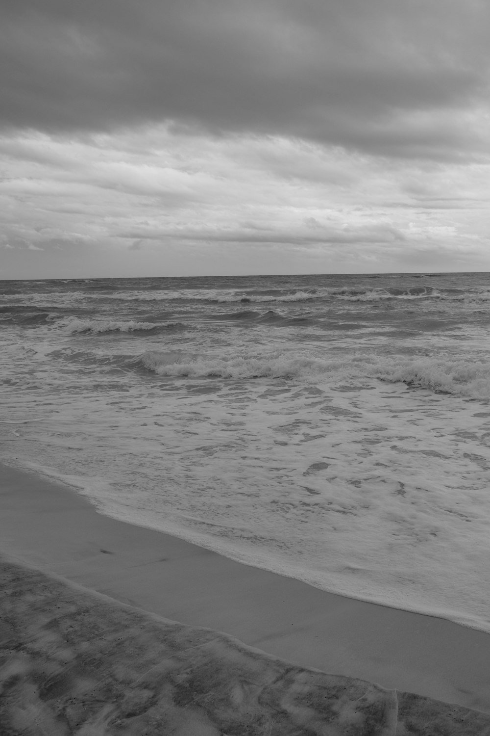 a black and white photo of the ocean