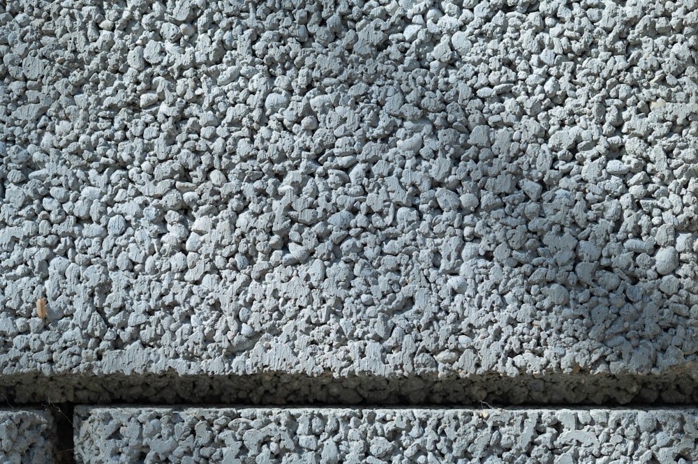 a close up of a bench made of rocks