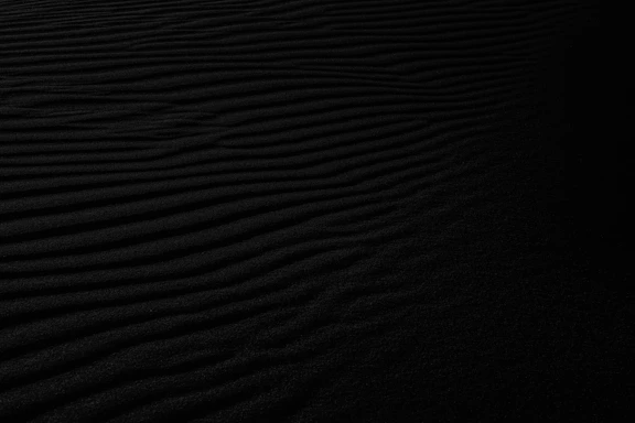 a black and white photo of a sand dune