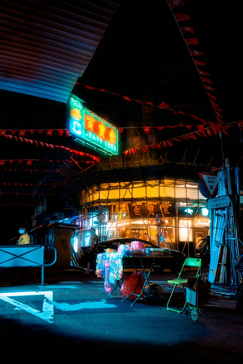 a building with a neon sign on the side of it