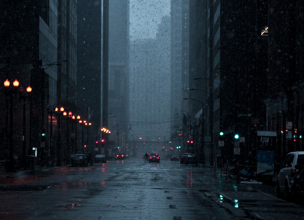 a city street at night in the rain