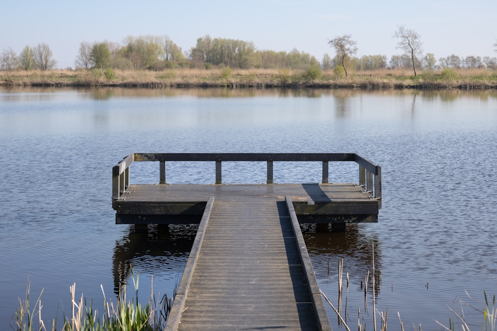 a wooden dock sitting on top of a body of water