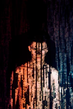 a man standing in front of a wall of words